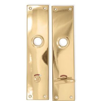 L64 Långskylt med WC vred mässing